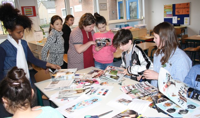 Leerlingen aan het werk tijdens de masterclass Fashion. Foto: De Wereldboom