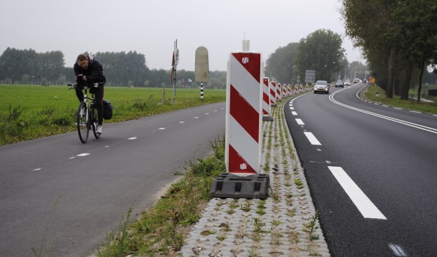 Door weer en wind langs de N236 naar Amsterdam.