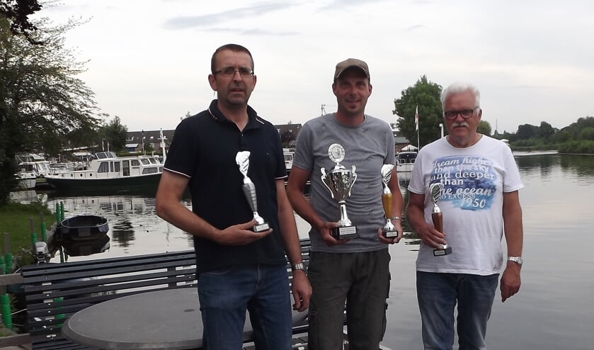 • Kees Kleijn, winnaar Barry de Koster en Kees Kool.