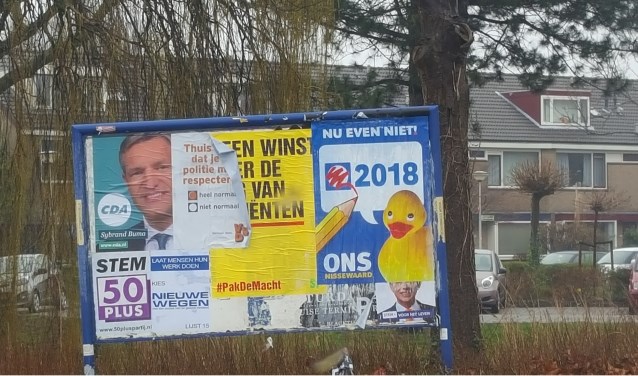 Posters over die van anderen heen plakken mag dus niet.