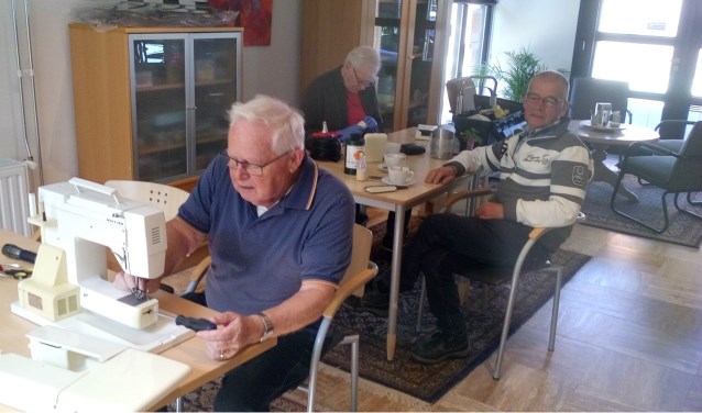 de mannen aan het werk
