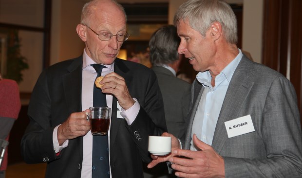Busser (rechts) tijdens een bijeenkomst in 2014.