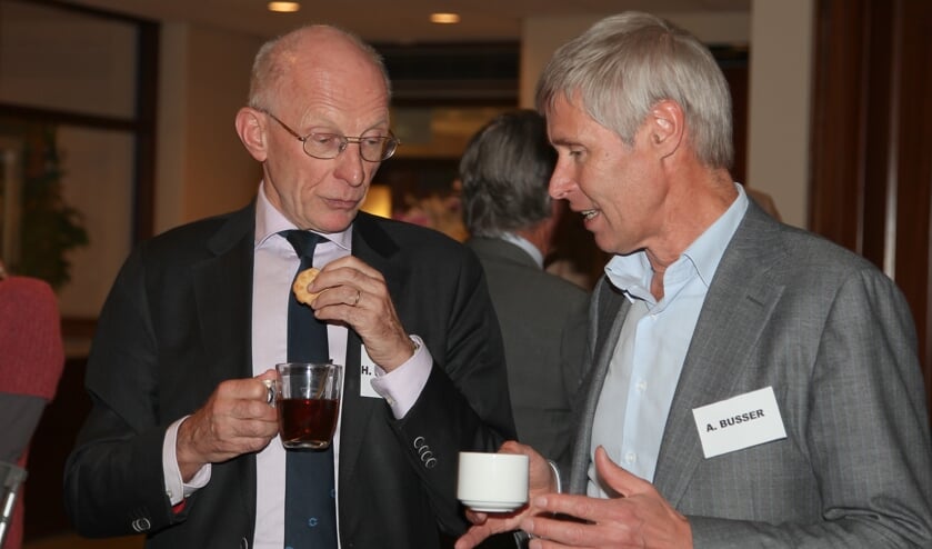 Busser (rechts) tijdens een bijeenkomst in 2014.