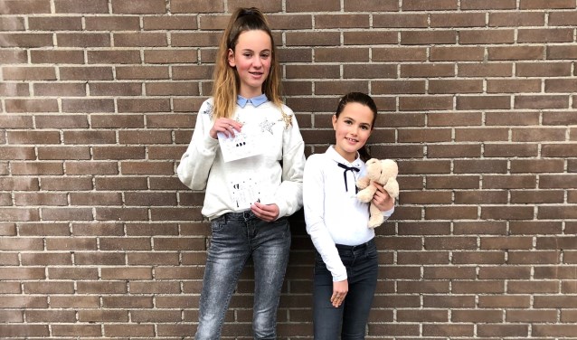 Maike Clement (12) en Indy Dautzenberg (11) nodigen iedereen uit om zaterdag 8 december met hen hun creativiteit in te zetten voor het goede doel